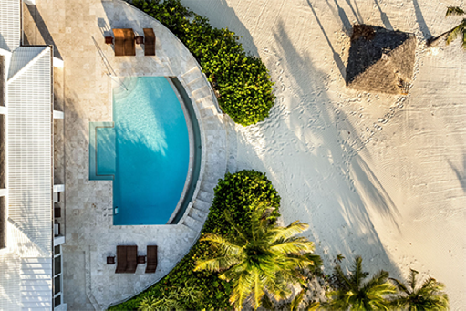 Aerial view of the oceanfront infinity pool and beach