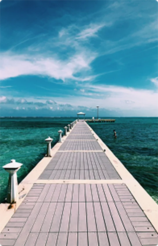 Pier reaching into the turquoise Caribbean sea