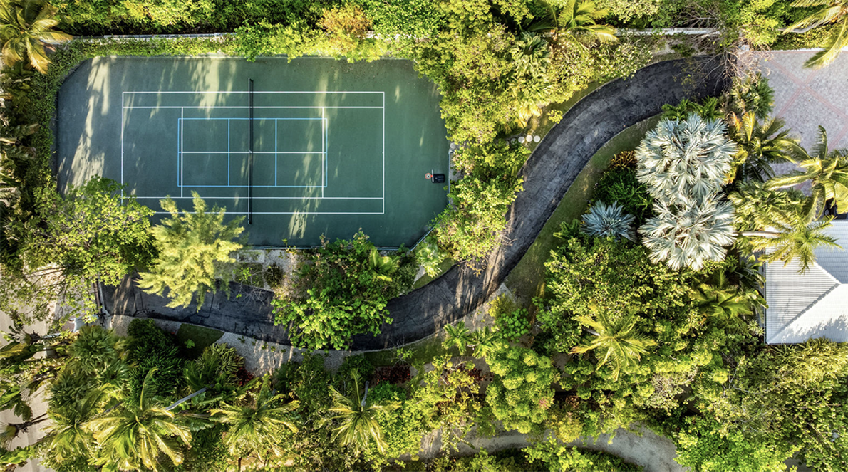 Private tropical tennis court at the estate