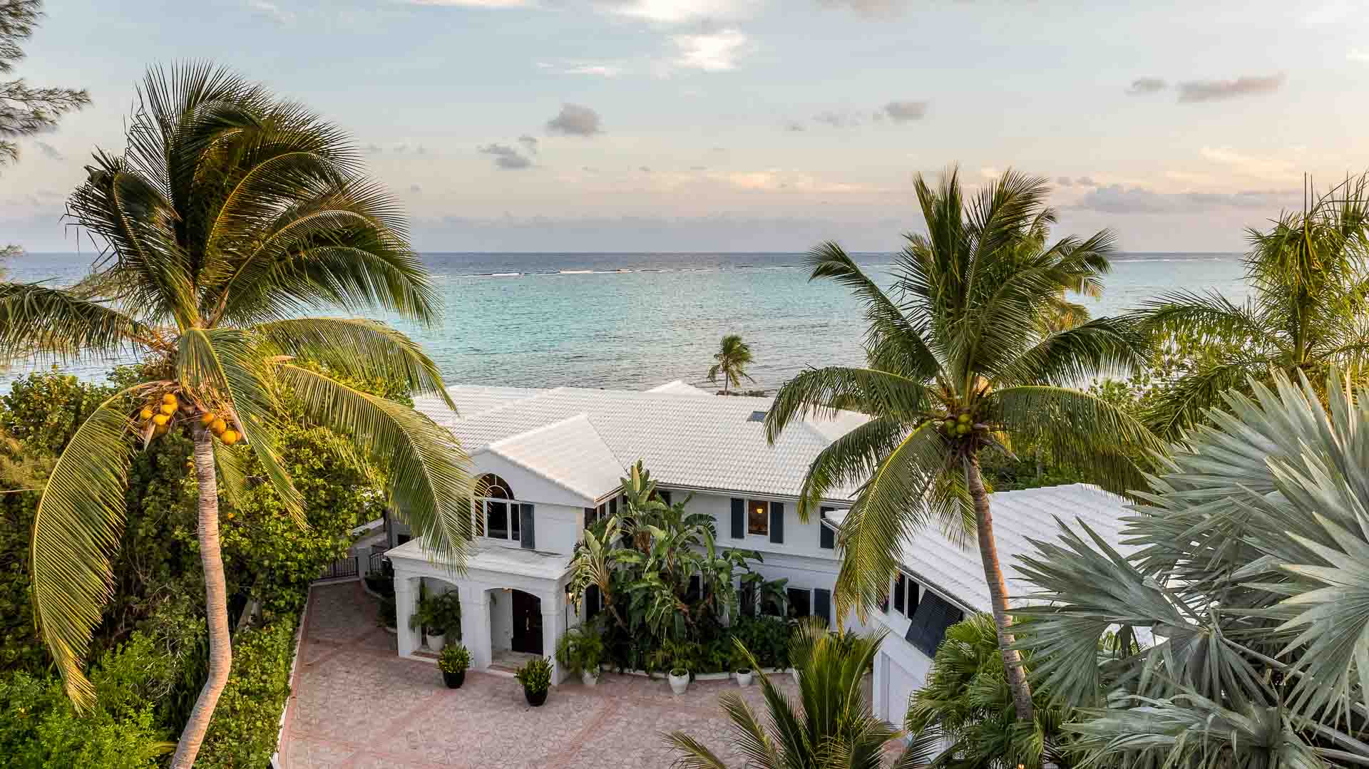 Beachfront villa on Grand Cayman at dusk